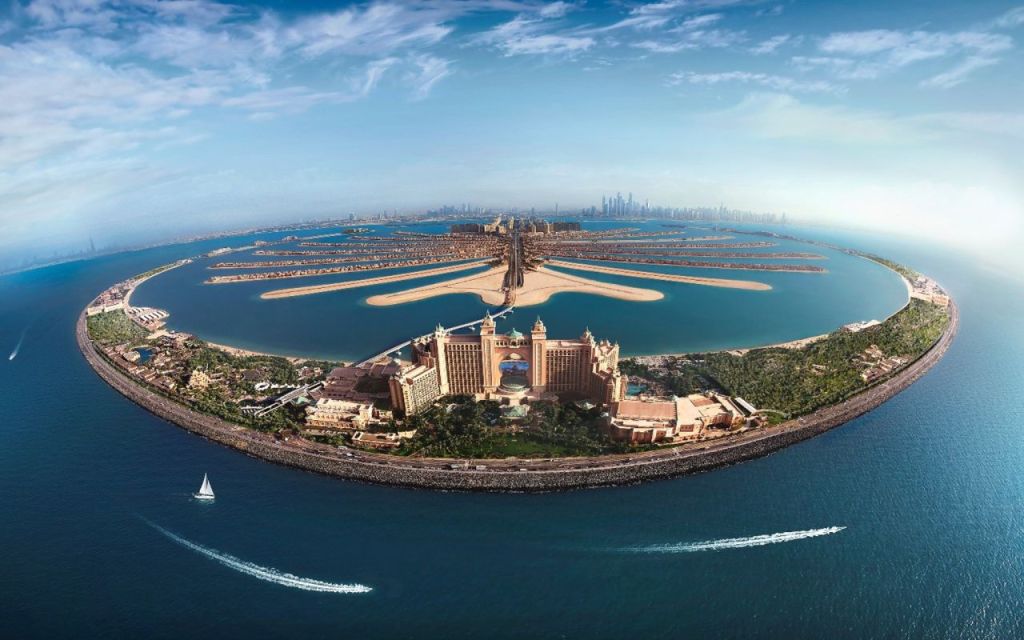 Explore Palm Jumeirah, Dubai's breathtaking artificial archipelago featuring luxury hotels, pristine beaches, and world-class dining options in a stunning palm-shaped design.