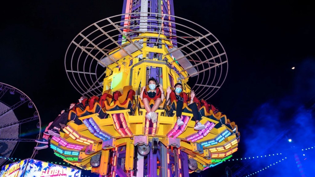 Global Village rides and entertainment including Carnaval attractions and live Main Stage performances at night